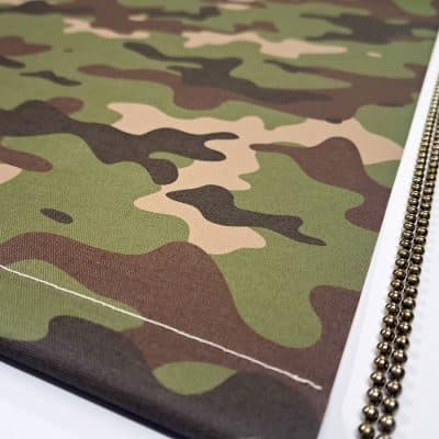 close-up of camouflage blackout blind with chrome chain and bottom bar stitching