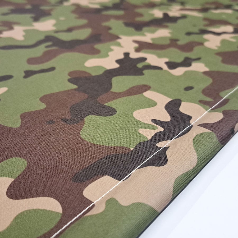 close-up of camouflage blackout blind bottom bar with switch