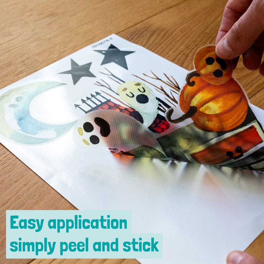 Haunted House Window Sticker being peeled off from backing sheet
