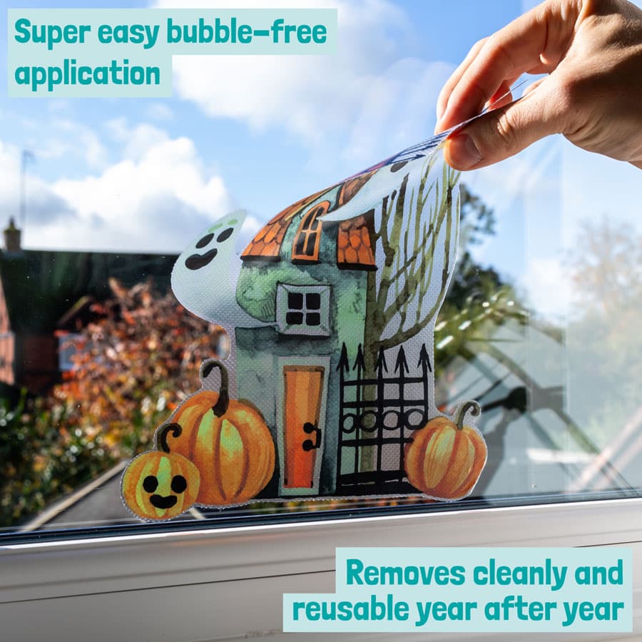 Haunted House Window Sticker close-up being removed cleanly from window