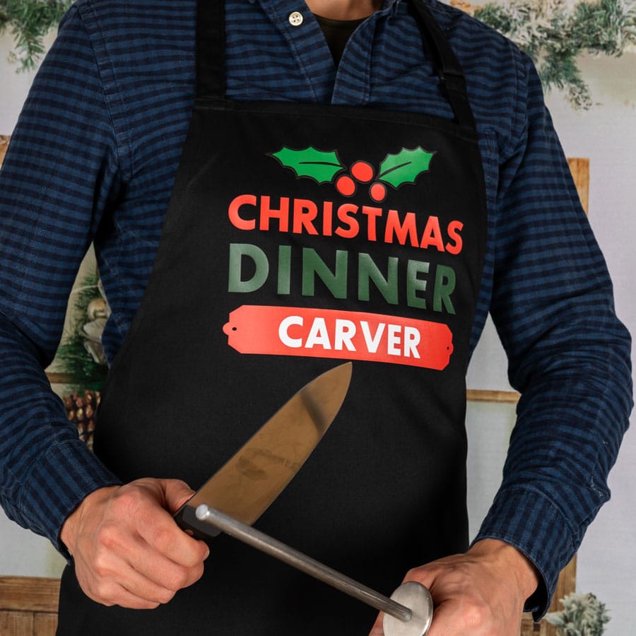 Personalised Christmas apron with carver text in black on a man novelty apron fun xmas