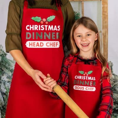personalised christmas dinner apron with mum and daughter in red baking christmas cooking