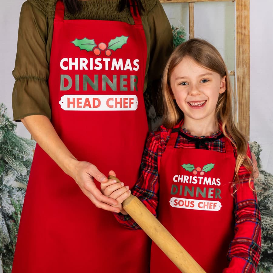 personalised christmas dinner apron with mum and daughter in red baking christmas cooking