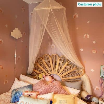 Rainbow and Stars Wall Stickers in a customer's room on a pink wall