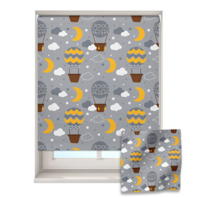 night-time balloons roller blind on a window with a fabric swatch in front