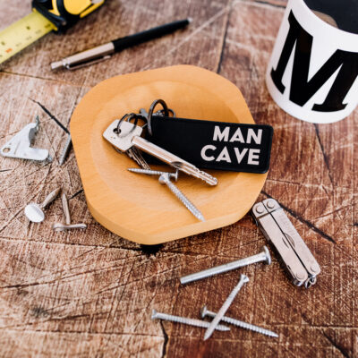 man cave keyring in black and gold
