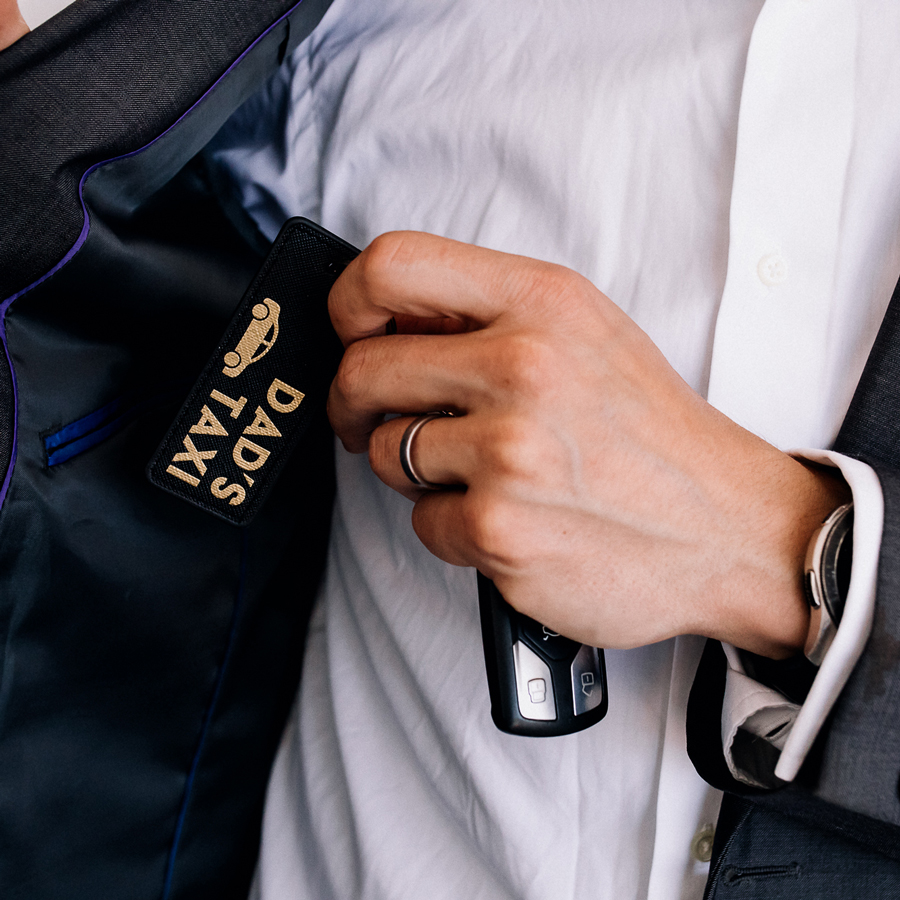 dad's taxi keyring in black and gold