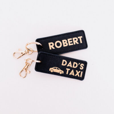 dad's taxi keyring in black and gold