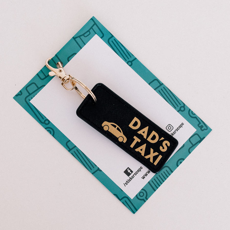 dad's taxi keyring in black and gold
