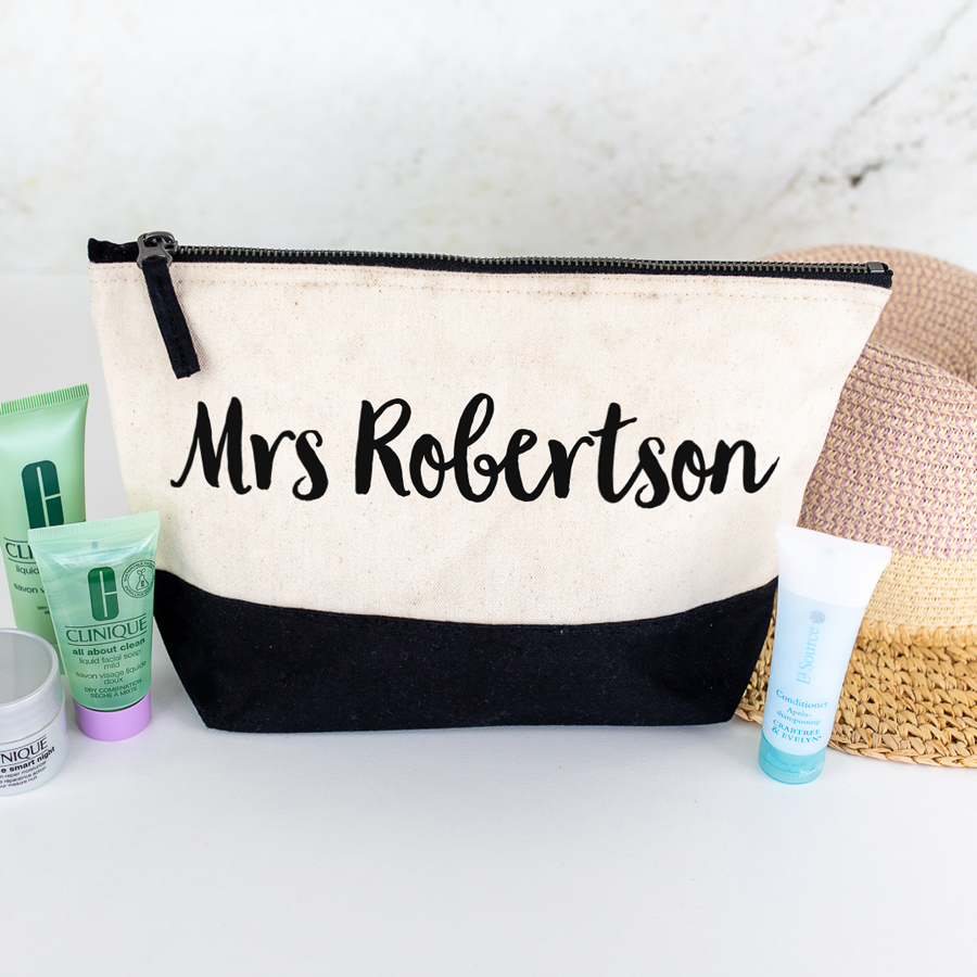 personalised last name wash bag in black with black text