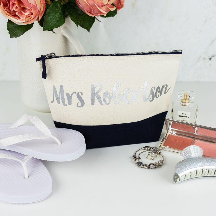 personalised last name wash bag in navy with silver text