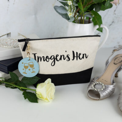 hen do bundle, black wash bag with black text, blue keyring with gold foil glasses on the keyring