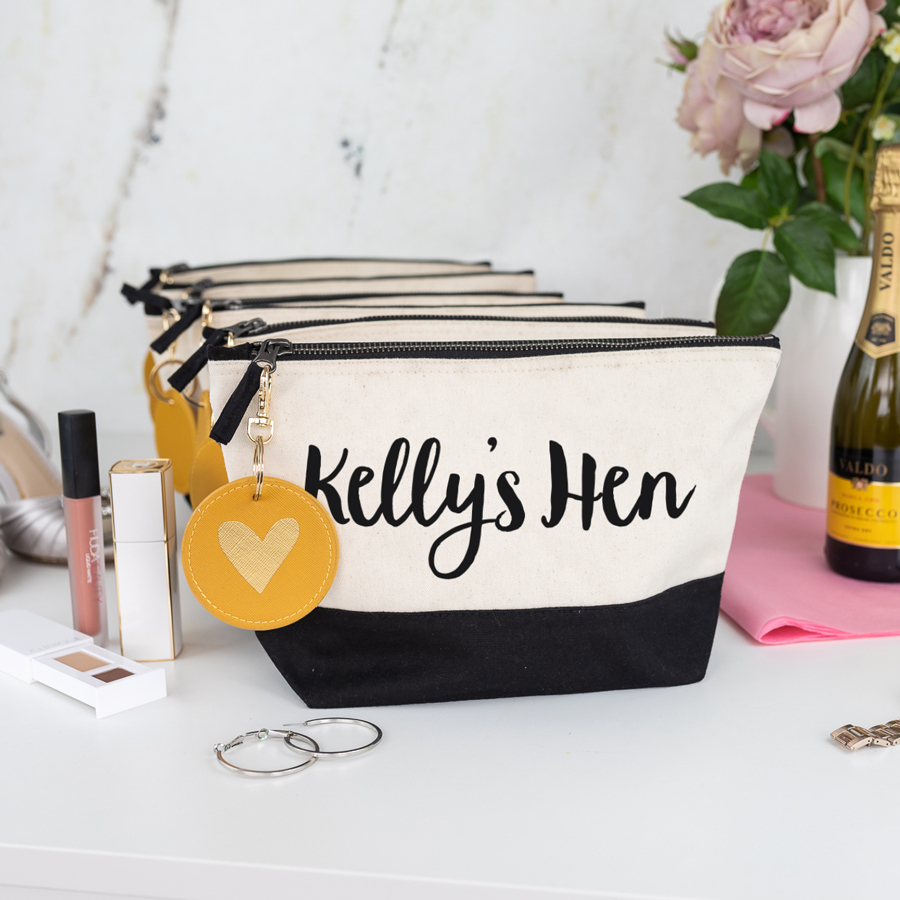 hen do bundle, black wash bag with black text, mustard keyring with a gold foil heart on the keyring