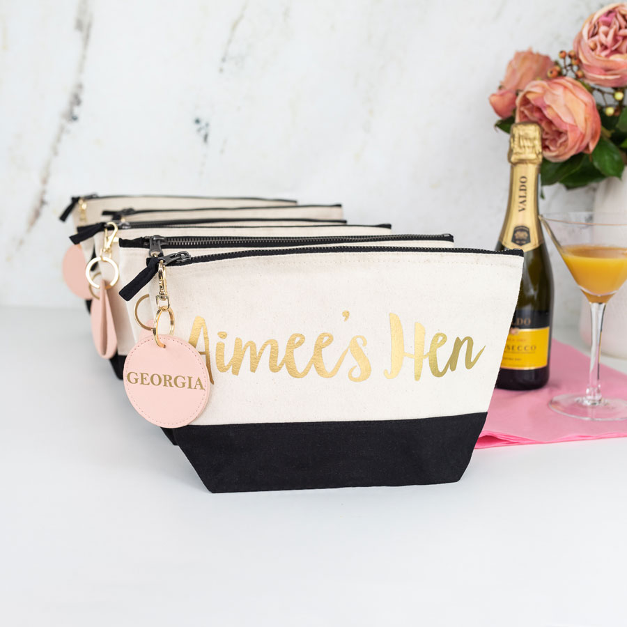 hen do bundle, black wash bag with gold text, pink keyring with a gold foil name on the keyring