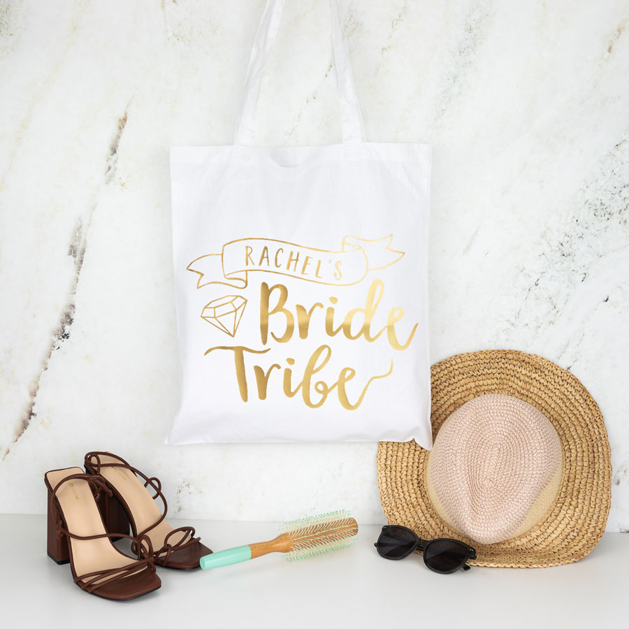 bride tribe tote bag in white with gold text