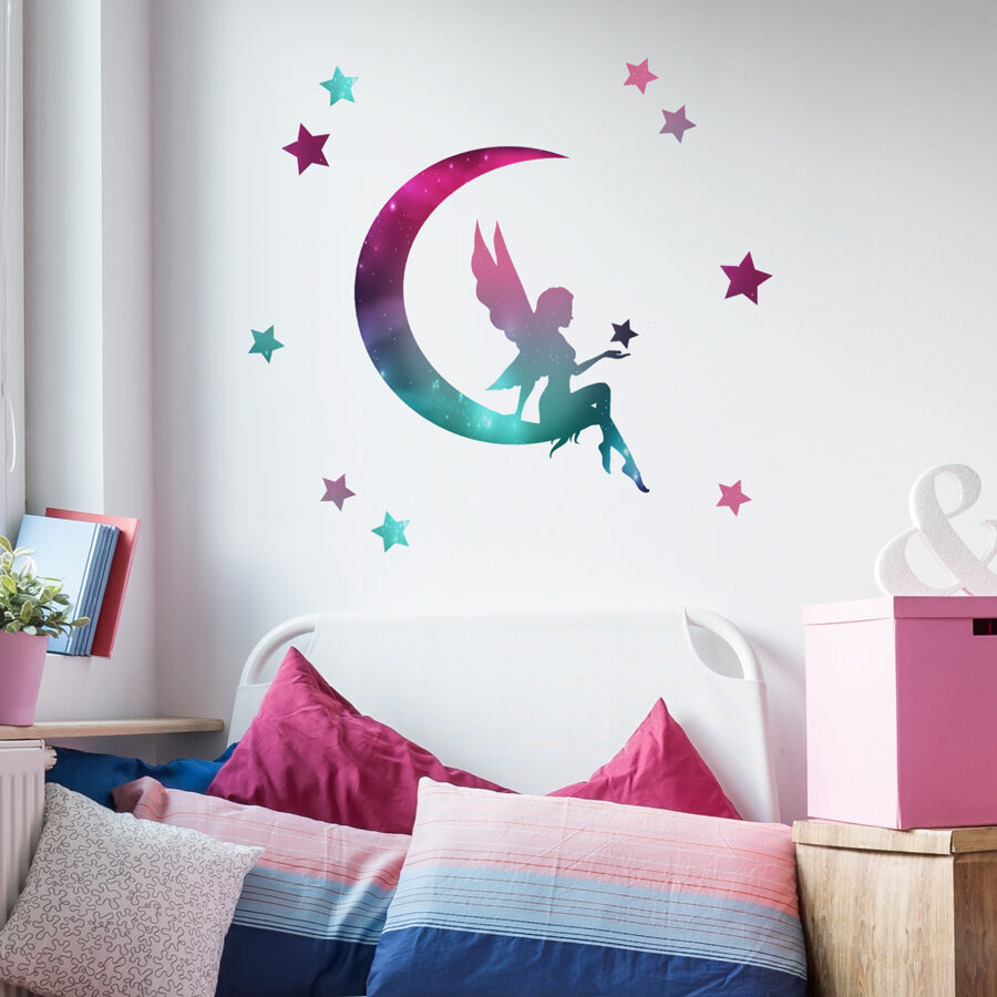 fairy silhouette sparkle wall sticker shown on a wall above a bed