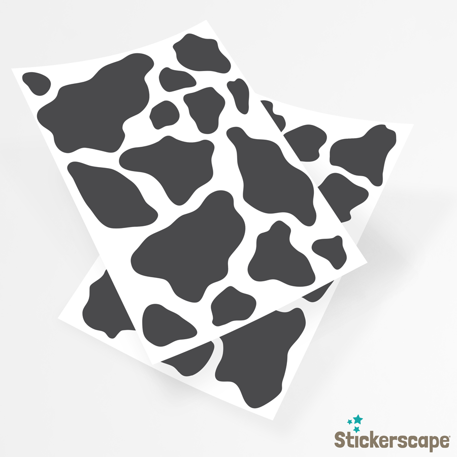 cow print wall sticker pack in black shown on the sheets