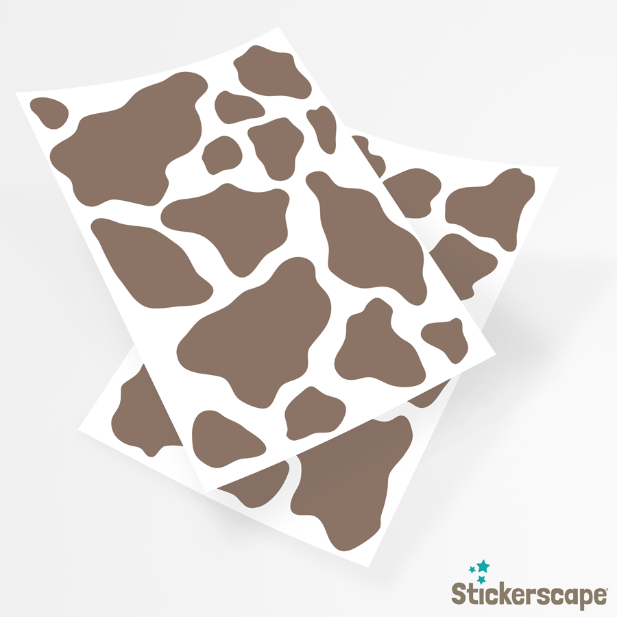 cow print wall sticker pack in light brown shown on the sheets