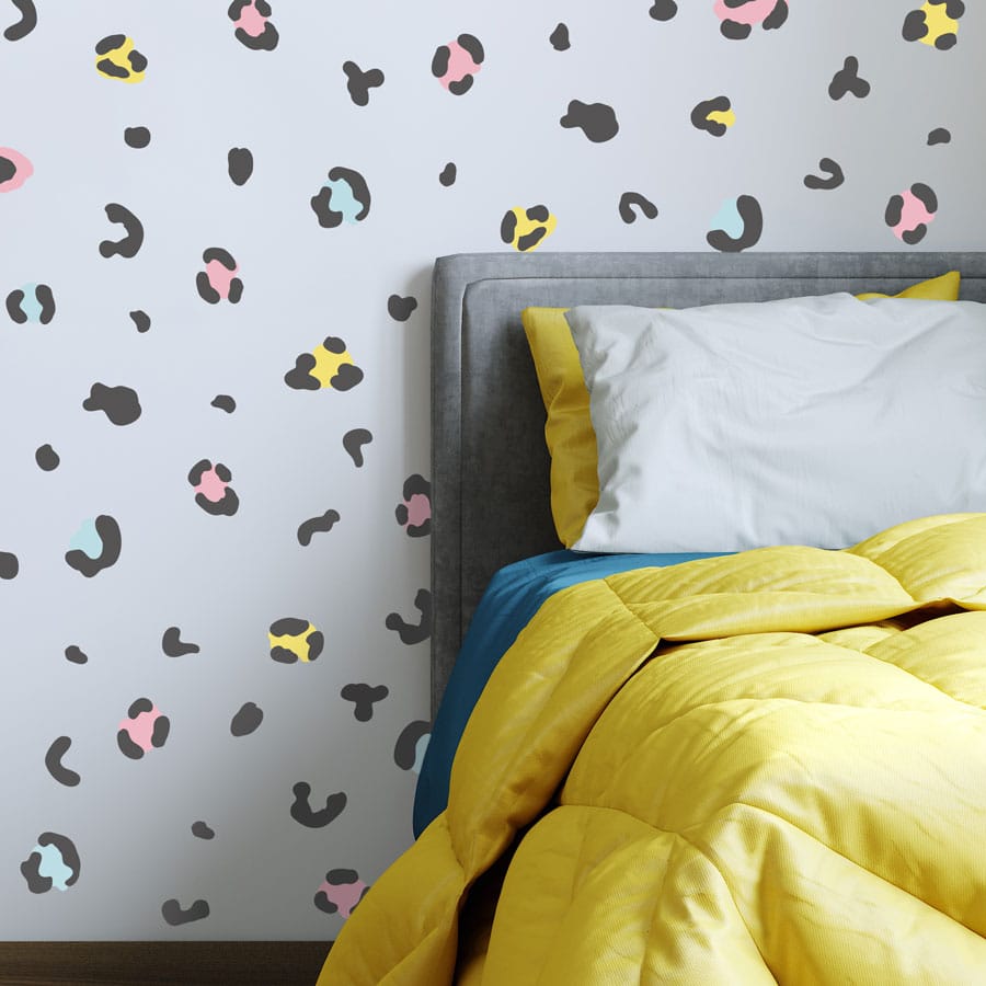 animal print wall stickers on a feature wall around a bed head