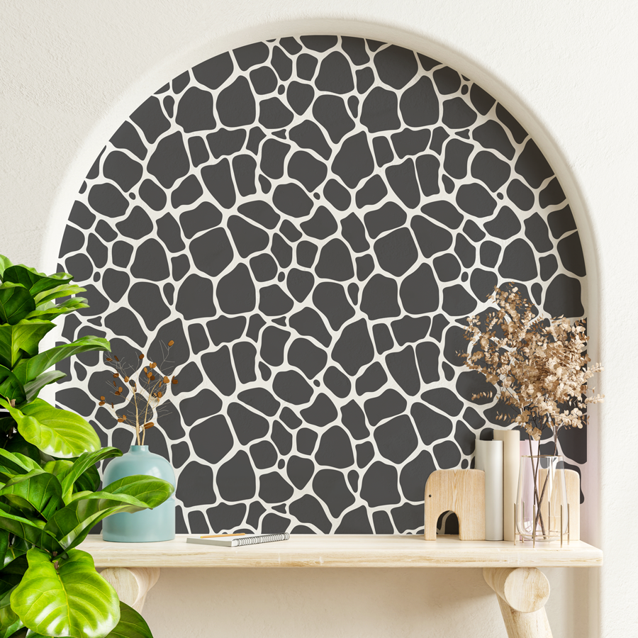 giraffe print wall sticker tile in black shown on an off white nook in the wall