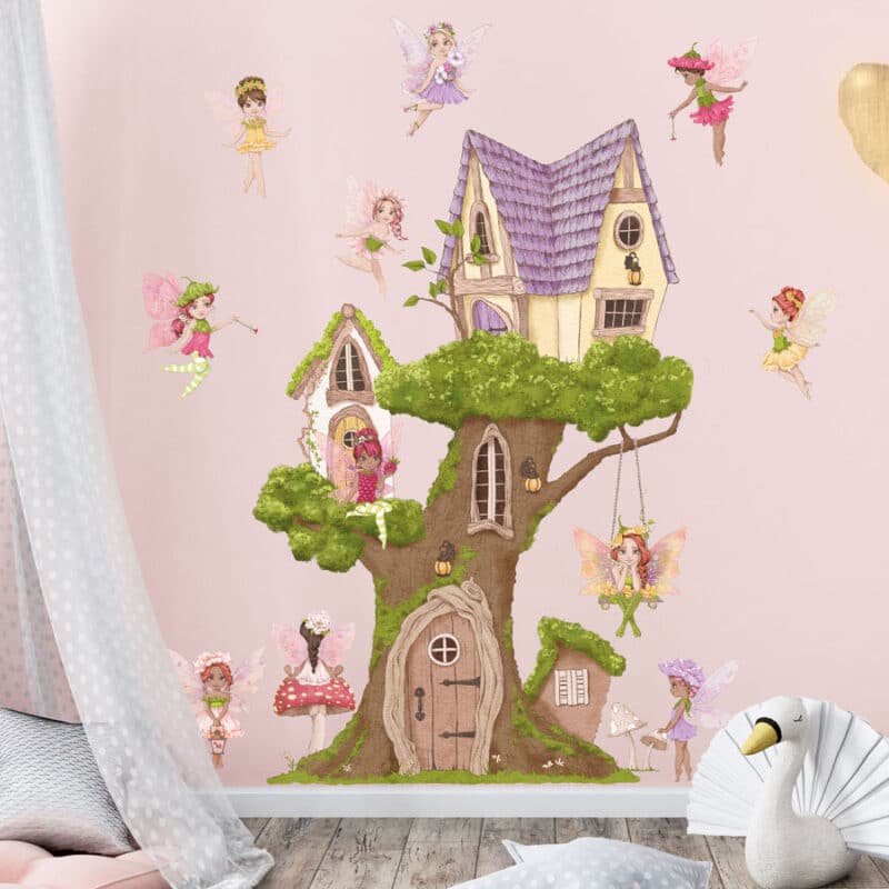 fairy tree house wall sticker shown on a pink wall