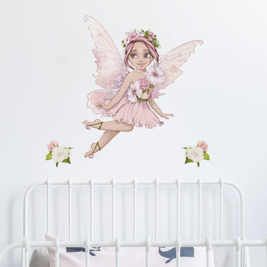 personalised flower fairy wall stickers in option 1 shown on a white wall above a headboard of a white bed