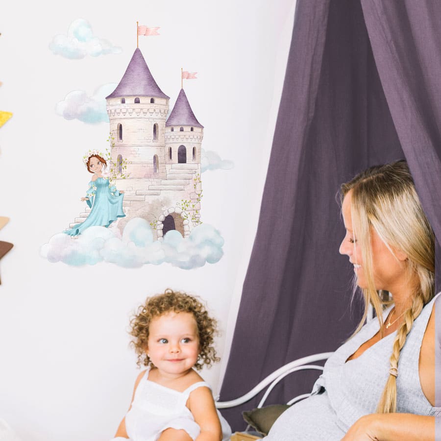 dreamy castle wall sticker in option 2 shown on a white wall behind a purple curtain