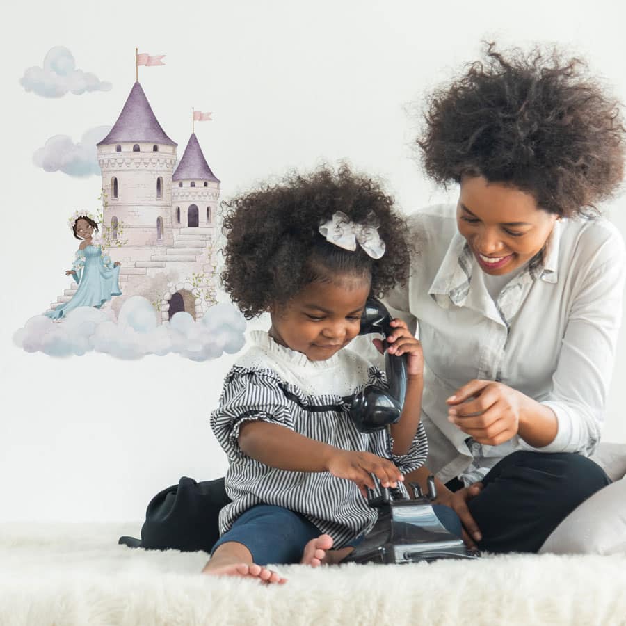 dreamy castle wall sticker in option 1 shown on a white wall behind a mother and child