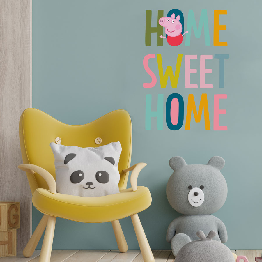 home sweet home wall sticker, peppa pig wall sticker shown on a blue wall behind a yellow chair
