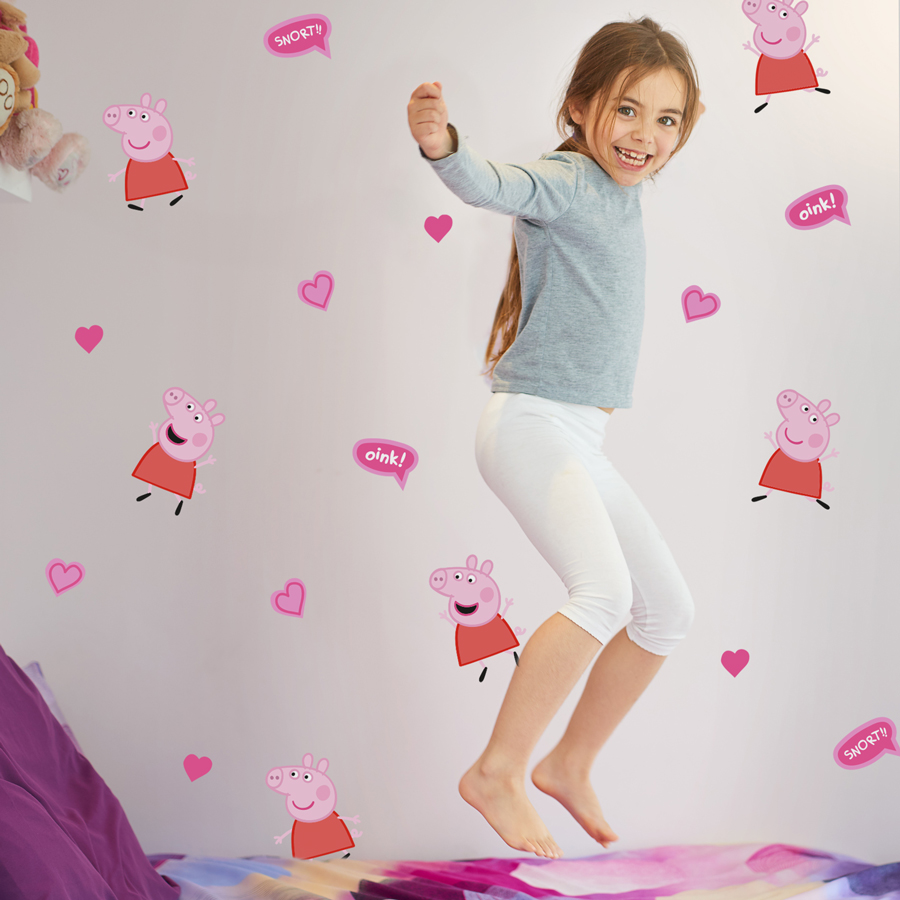 pink peppa pig wall stickers on a grey wall