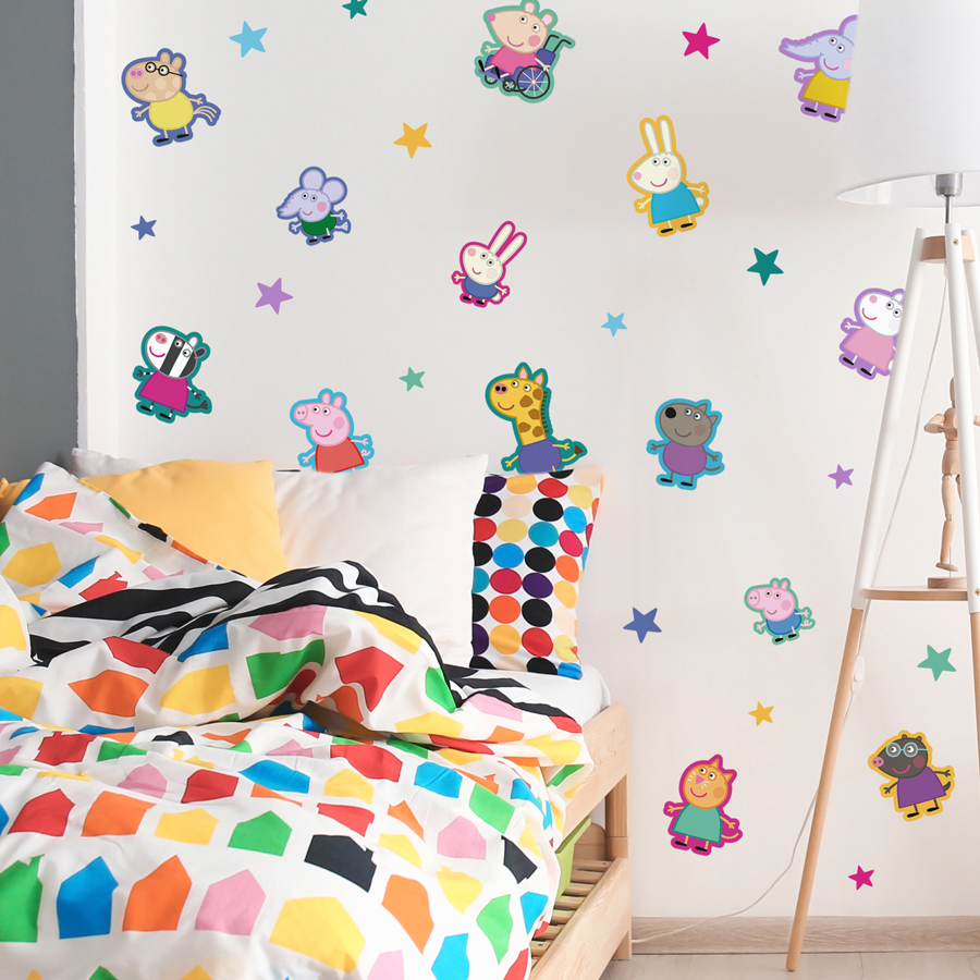 Peppa & friends wall sticker pack shown on a light coloured wall behind a colourful bed