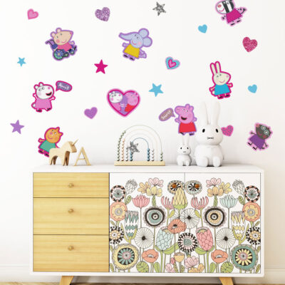 peppa & friends pink wall sticker pack shown on a white wall behind a decorative wooden set of drawers