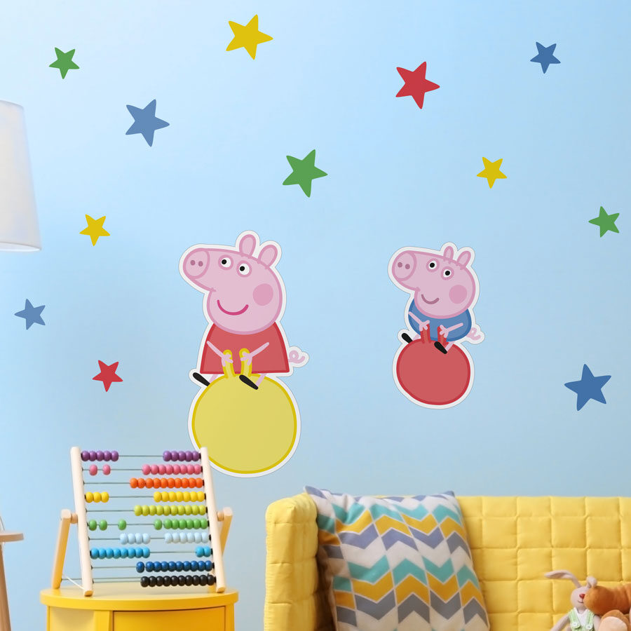 Peppa & George wall sticker pack shown on a light blue wall behind a yellow sofa