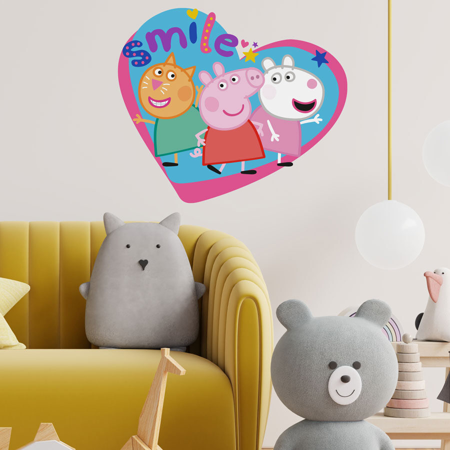 peppa and friends smile wall sticker shown on a light coloured wall behind a yellow sofa