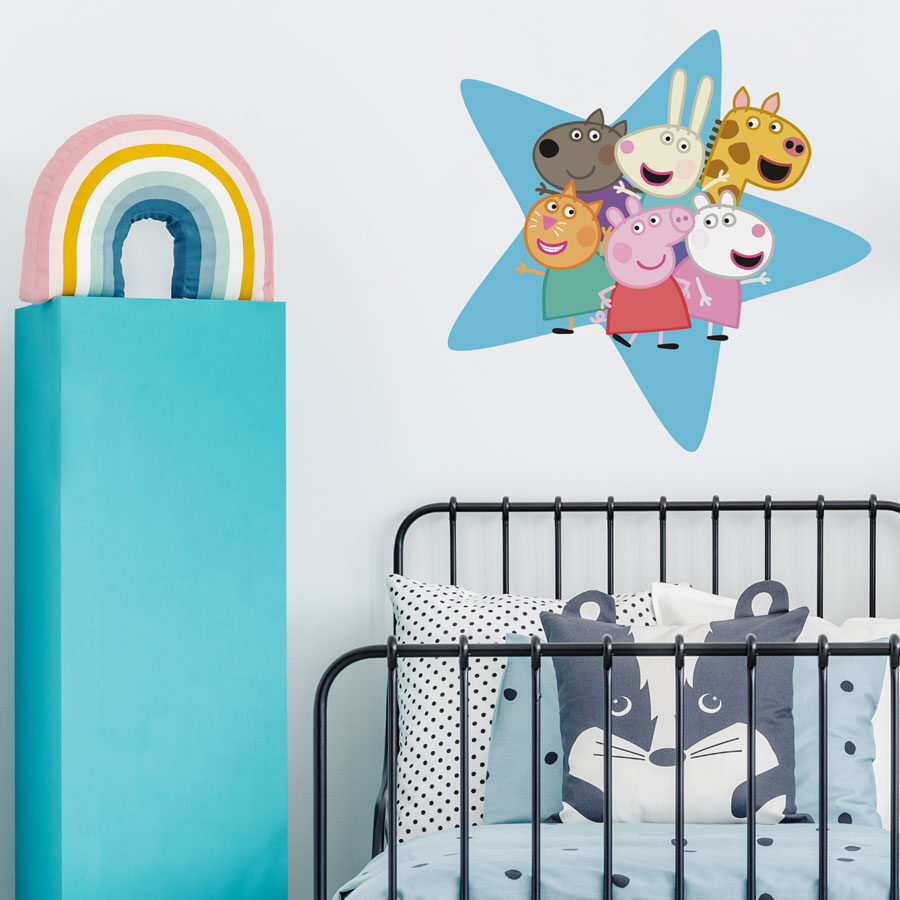 Peppa & friends star wall sticker shown on a white wall behind a black bed