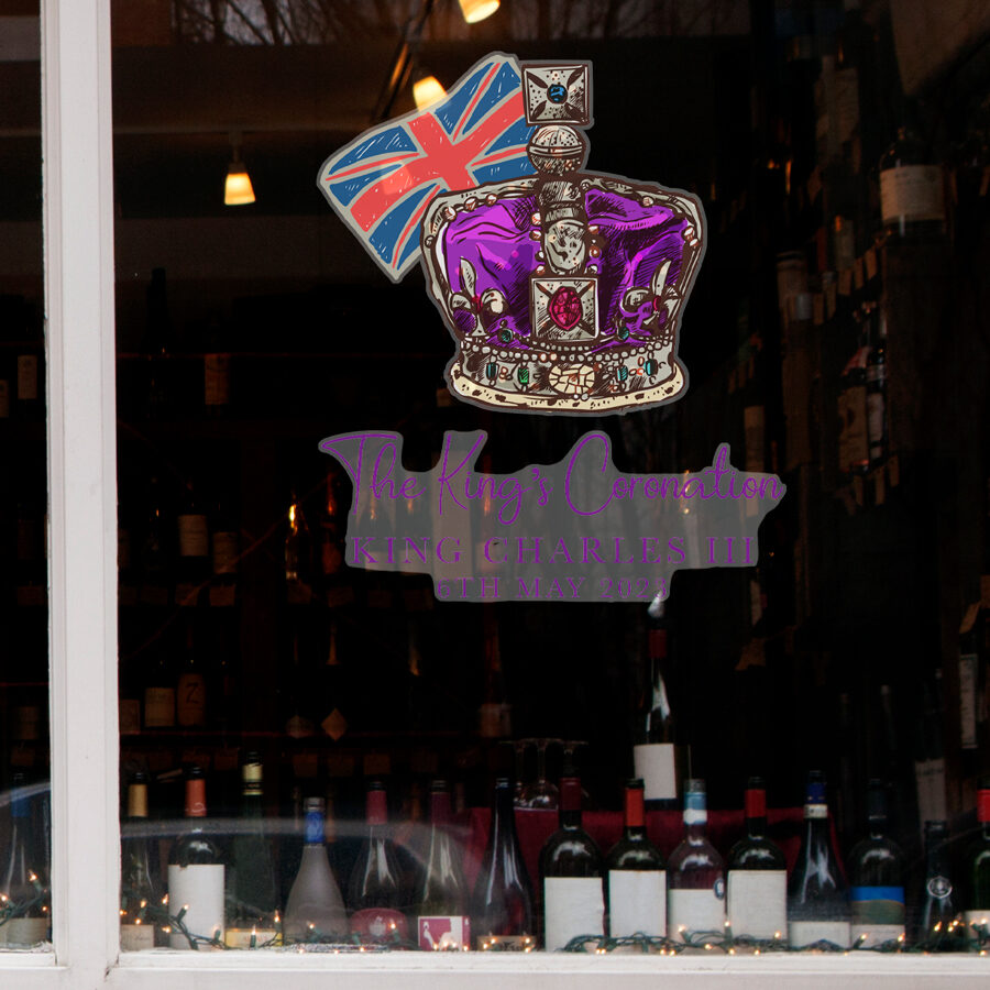 King Charles' crown window sticker shown on the inside of window in a pub