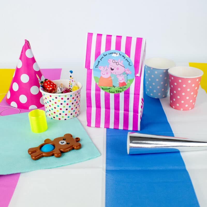 personalised peppa pig party label pack shown stuck to a pink striped party bag