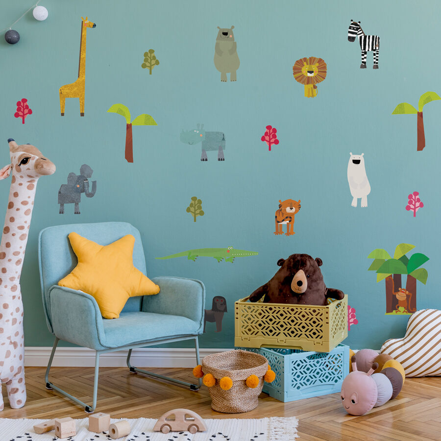 fun animals wall sticker pack shown on a blue wall behind a blue chair and large plush giraffe