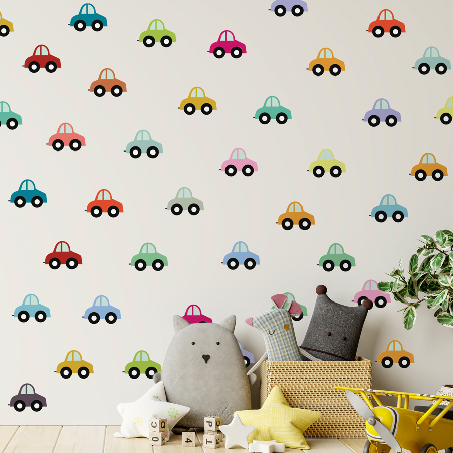 rainbow cars wall sticker pack large shown on a light coloured wall behind grey pillows and yellow toy airplane