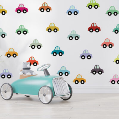 rainbow cars wall sticker pack regular shown on a white wall behind a child sized car