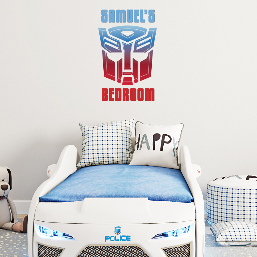 Personalised autobots wall sticker large shown behind a bed shaped like a car