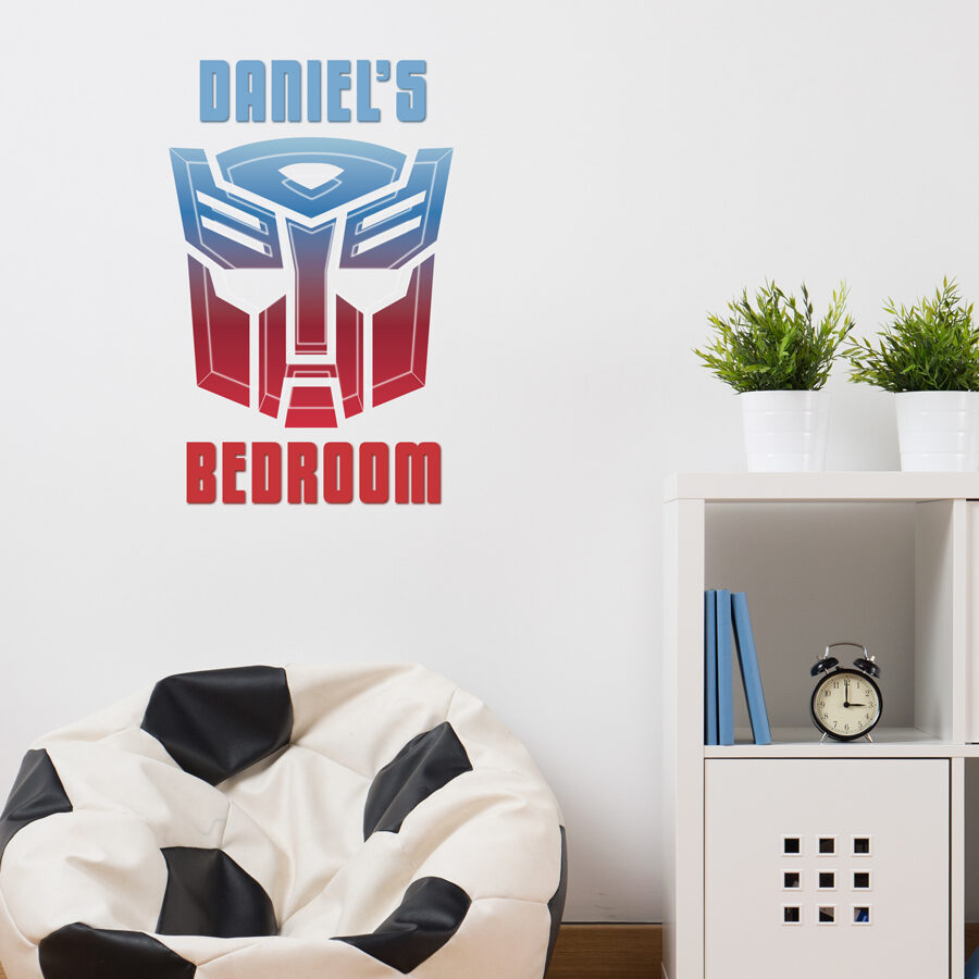 Personalised autobots wall sticker regular on a light grey wall behind a bean bag