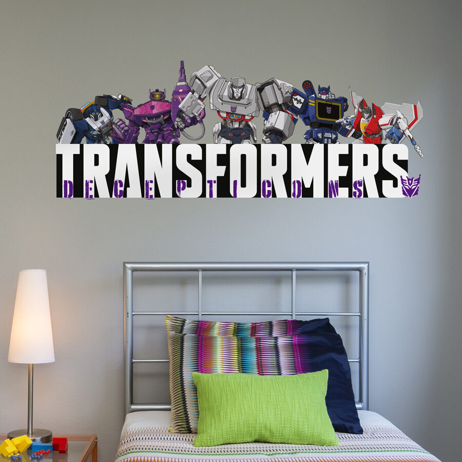 Decepticon group wall sticker shown on a grey wall behind a metal bed