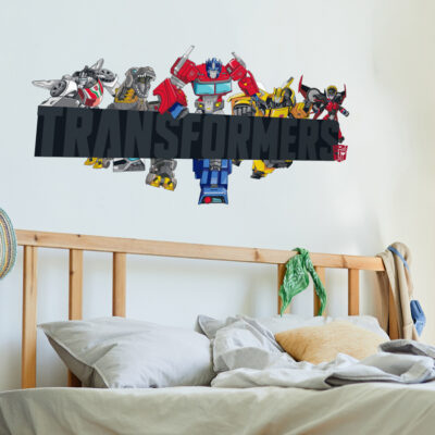 Transformers group wall sticker large shown on a white wall behind a wooden bed frame