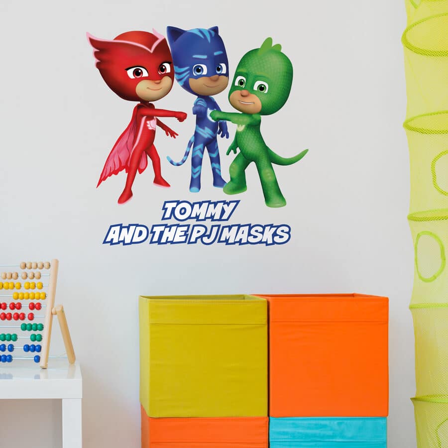 Personalised Pj Masks wall sticker shown on a white wall behind colourful blocks