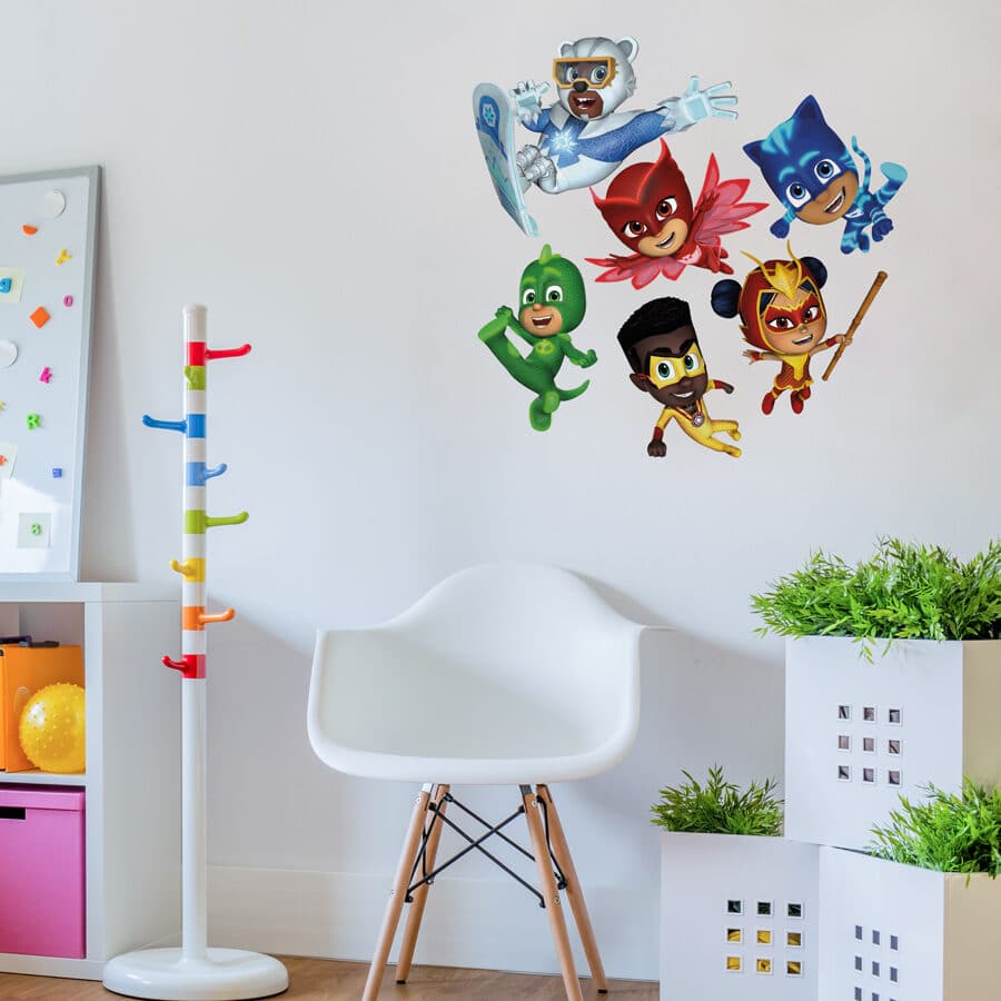 power heroes group wall sticker large shown on a white wall behind white boxes and a white chair