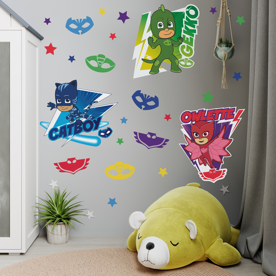PJ Masks & stars wall sticker pack shown on a grey wall behind a large yellow teddy bear
