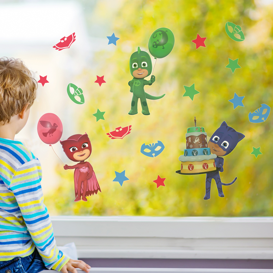 PJ Masks party window stickers regular shown on a window with a young boy looking out