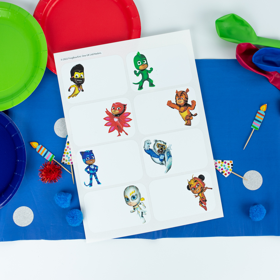 PJ Masks birthday label pack option 2 shown on a table decorated for a party