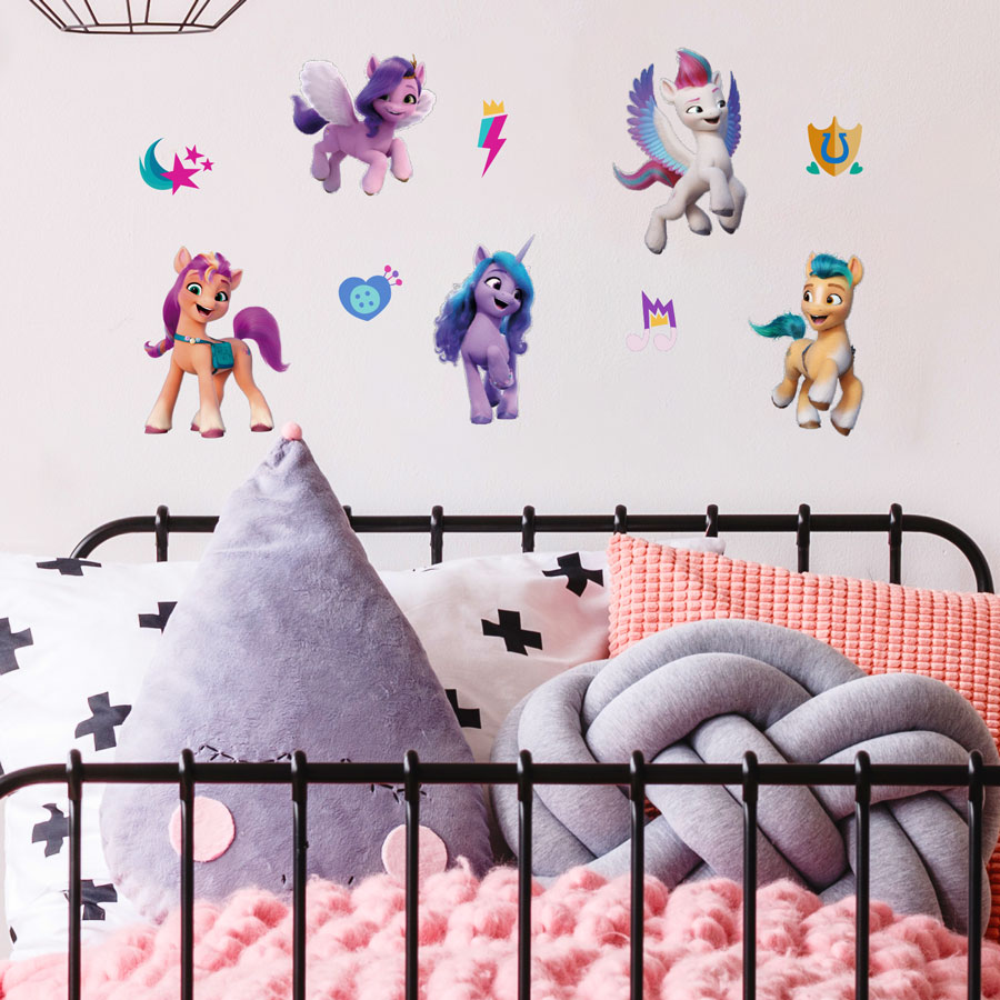 My Little Pony Wall Stickers shown on a white wall behind a black bedframe with white, pink and grey bedding
